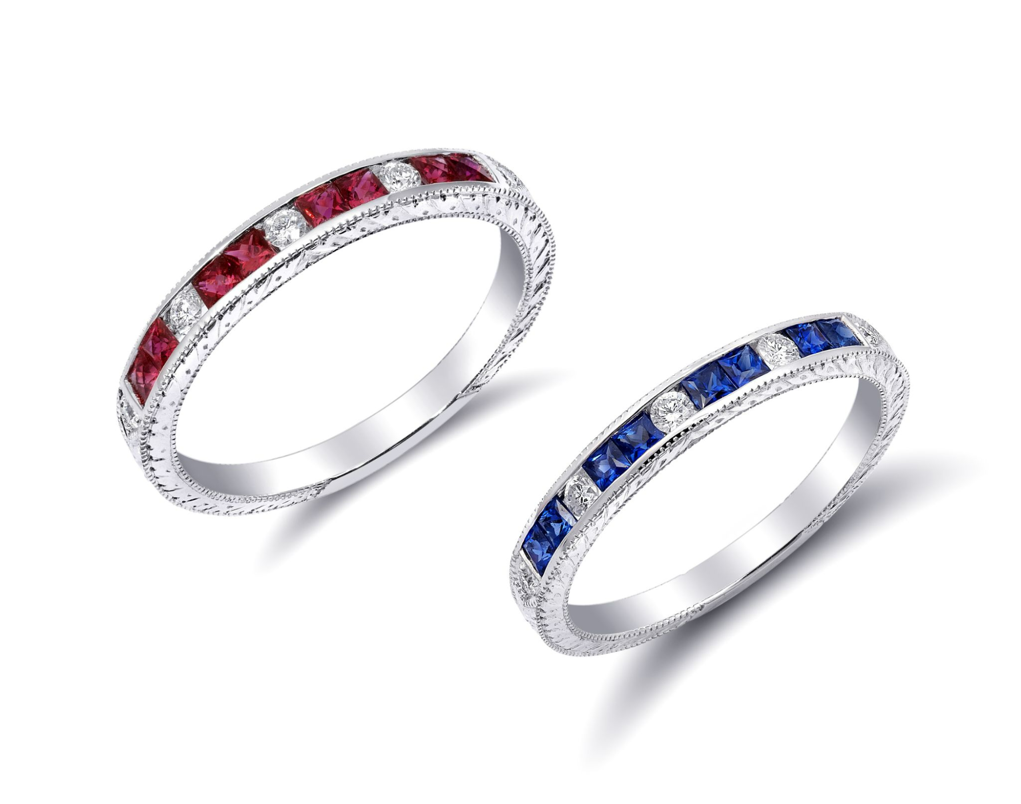 A pair of birthstone stacking rings against a white backdrop