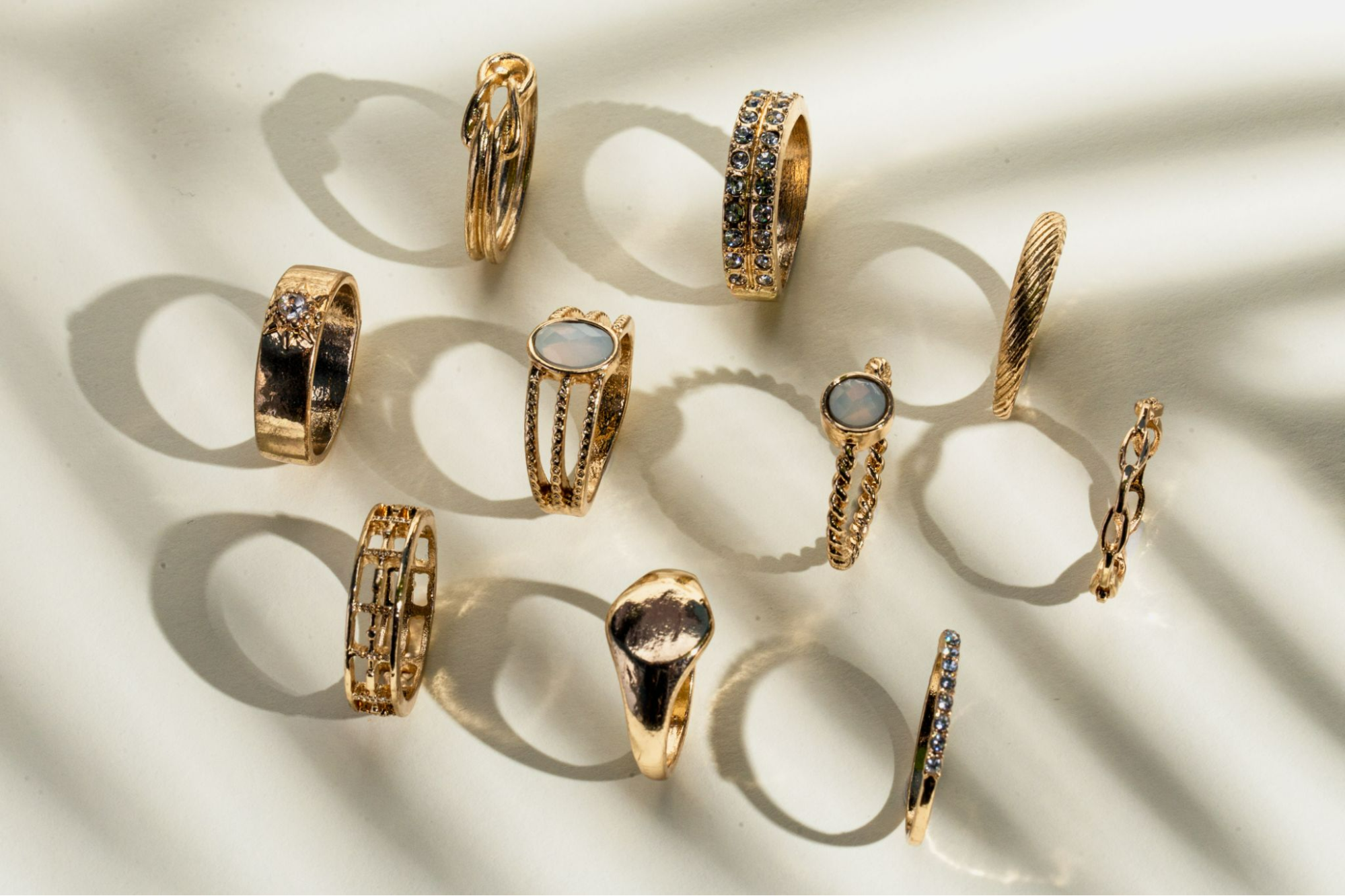 A set of gold stacking rings in a variety of styles, sizes and textures 