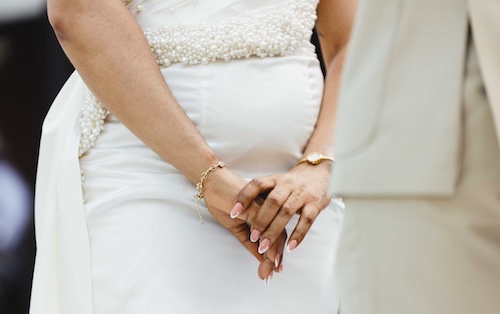 Woman wearing minimalist jewelry