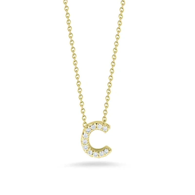 Roberto Coin eighteen karat yellow gold diamond love letter necklace suspended on an eighteen karat yellow gold oval link chain measuring 18 inches adjustable to 16 inches