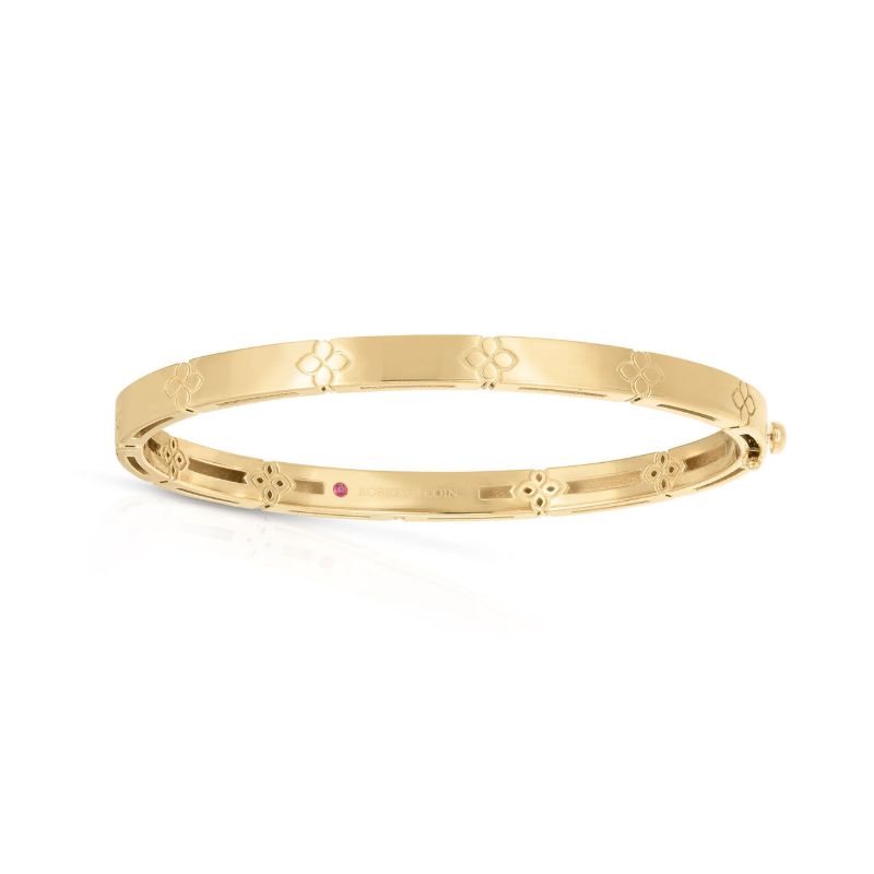 Roberto Coin 18 karat yellow gold Love in Verona narrow bangle  48 x 58mm  The bangle has a Florentine design with etched flowers.